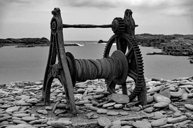 An old rusting winch which was used to pull boats in and out of the water at Scotchport, Co Mayo. Photo: Anthony Hickey
