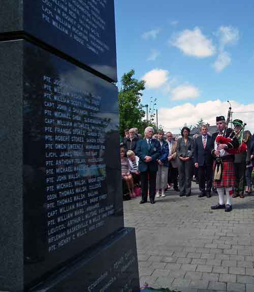  PJ Clarke, Chairman of the Ballina Comrades of the Great War Committee, Cecile Dejardain, Athis Mons, An Taoiseach Enda Kenny TD, stand in silence as the piper, Sean Lavin, played 'A Lament for the Dead', at the Great War Remembrance Monument in the Green Park, Ballina, on Saturday June 20th 2015. Photo: Anthony Hickey